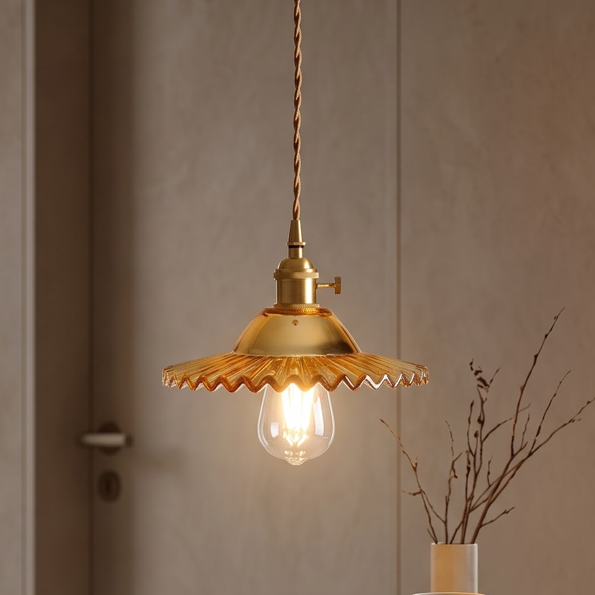 Amber scalloped glass pendant glowing above an oak writing desk