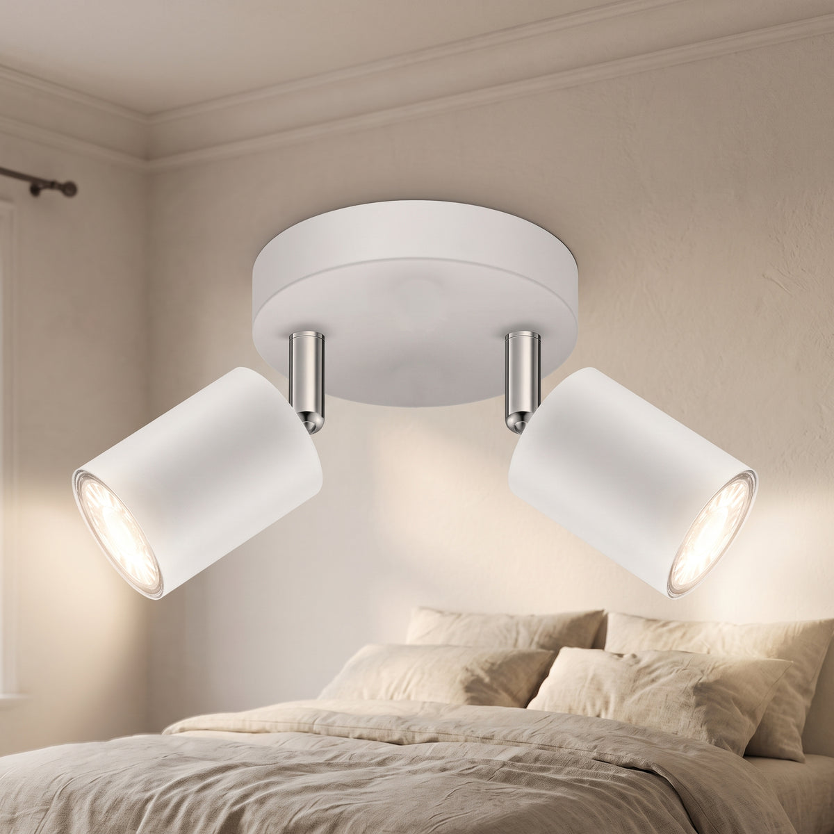White adjustable two-head ceiling spotlight in a calm bedroom