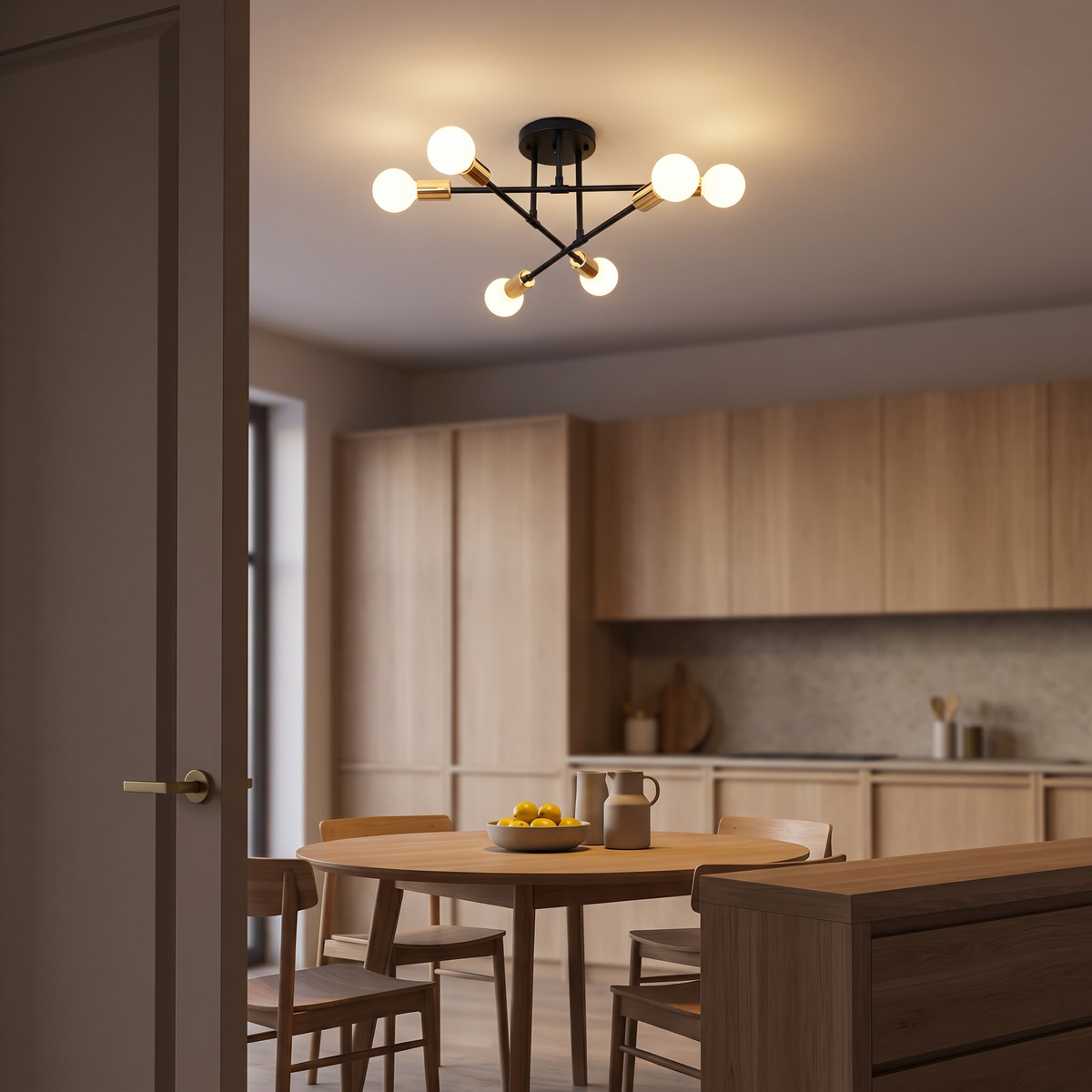 Black pinwheel ceiling light with gold sleeves over a round oak table