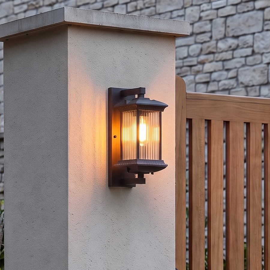 Dark bronze outdoor wall lantern with ribbed glass by a front door