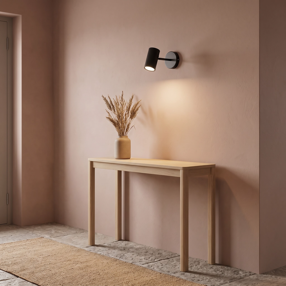 Black wall spot above an oak console with dried grasses