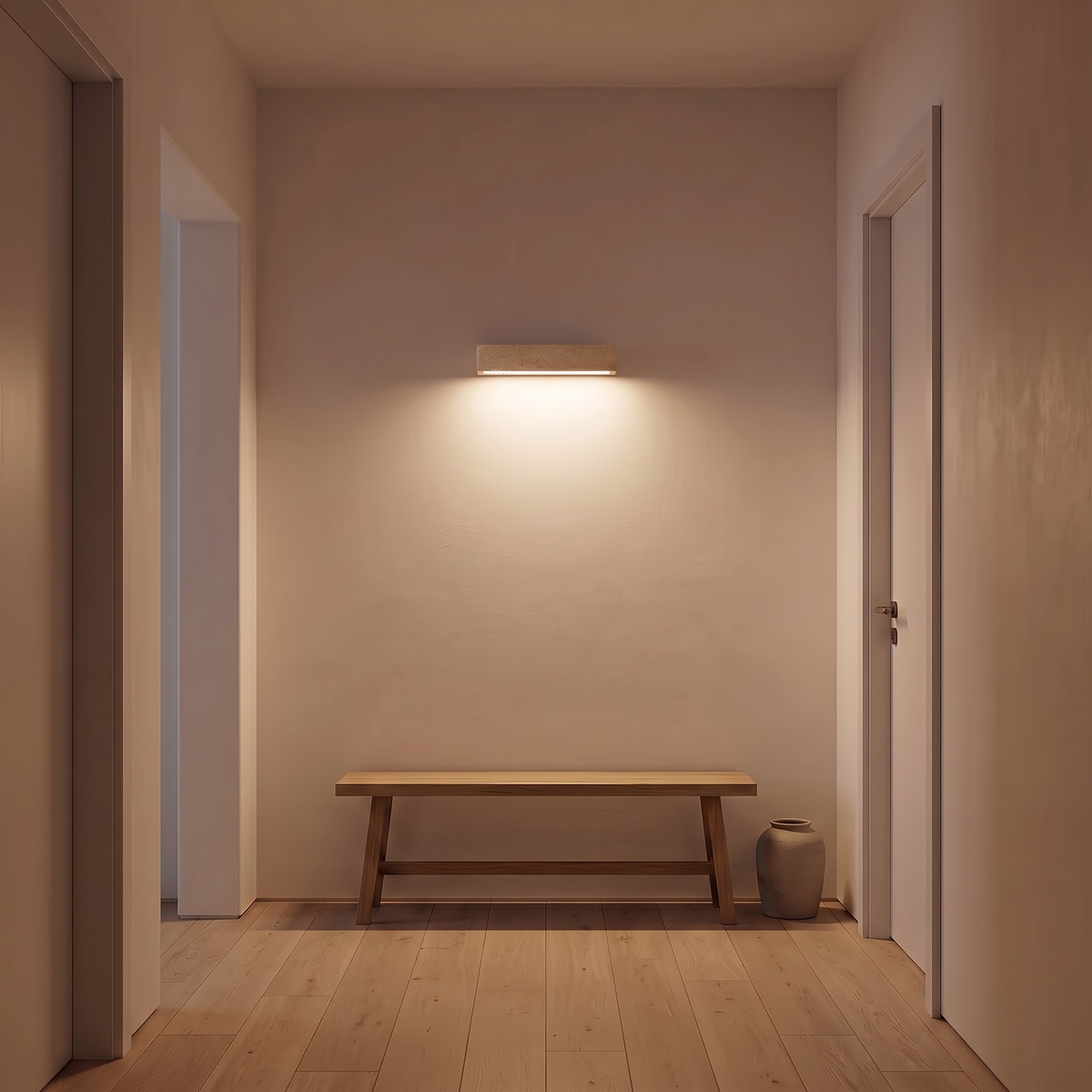 Travertine bar wall light above an oak bench in a hallway