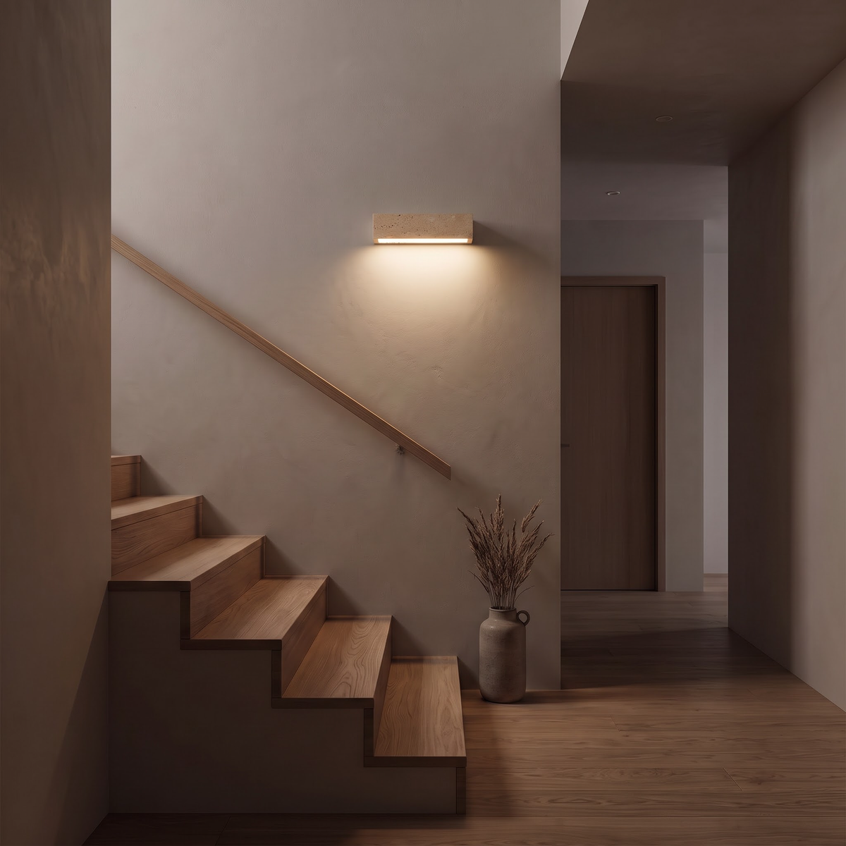 Pitted travertine wall bar lighting an oak stairwell at dusk