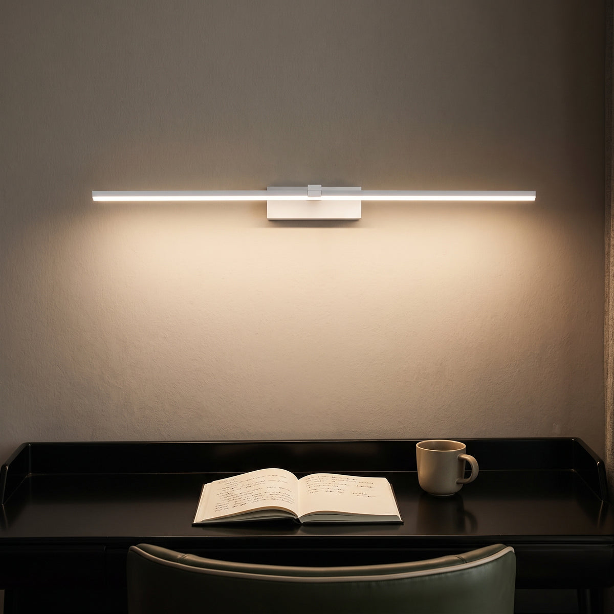 White linear LED wall sconce lighting a desk in a home study