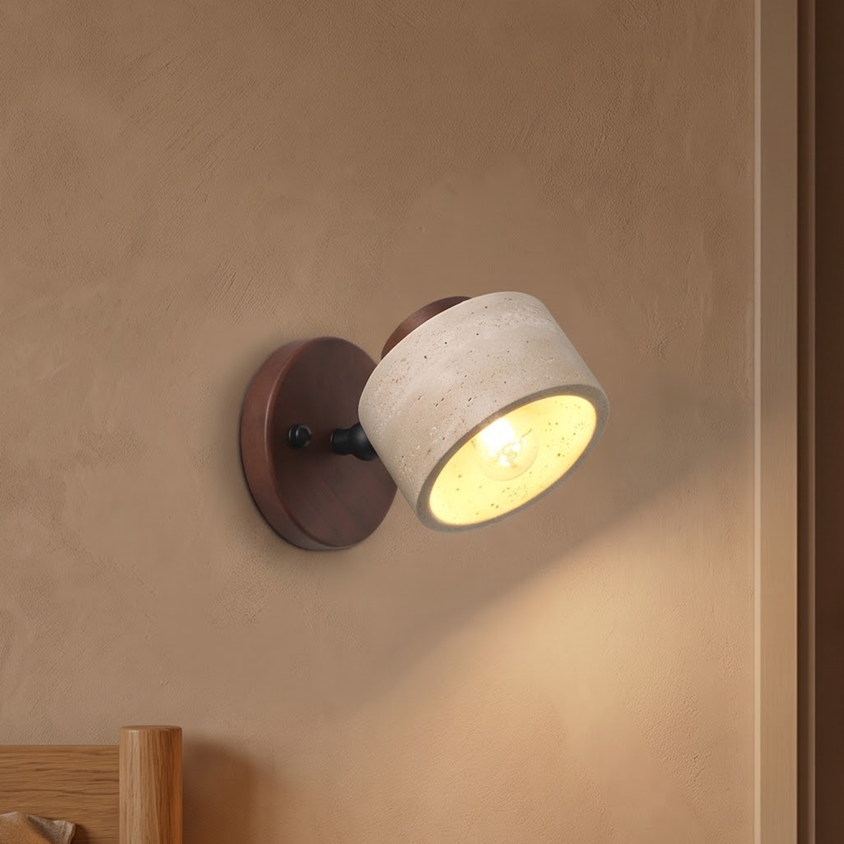 Travertine stone swivel wall light on a walnut plate above a nightstand