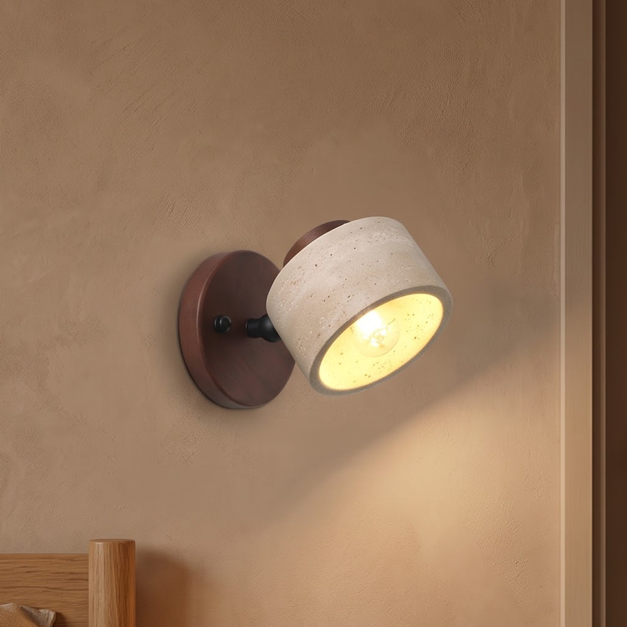 Travertine stone swivel wall light on a walnut plate above a nightstand