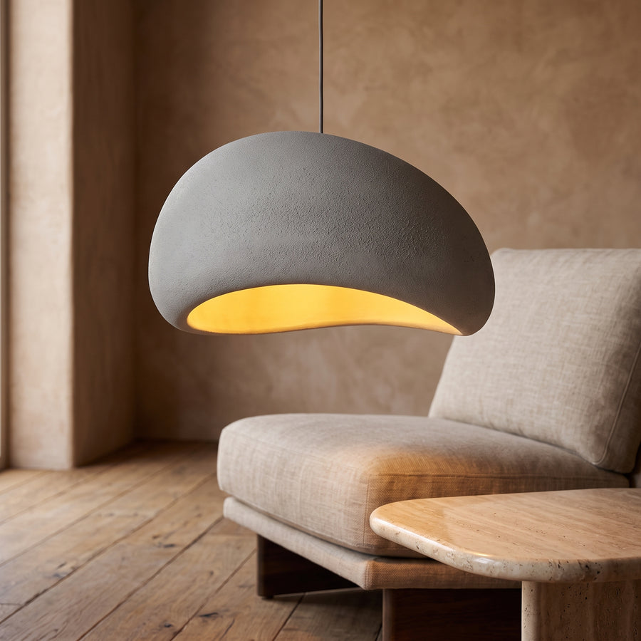 Gray dome wabi-sabi pendant lamp lighting a linen reading corner