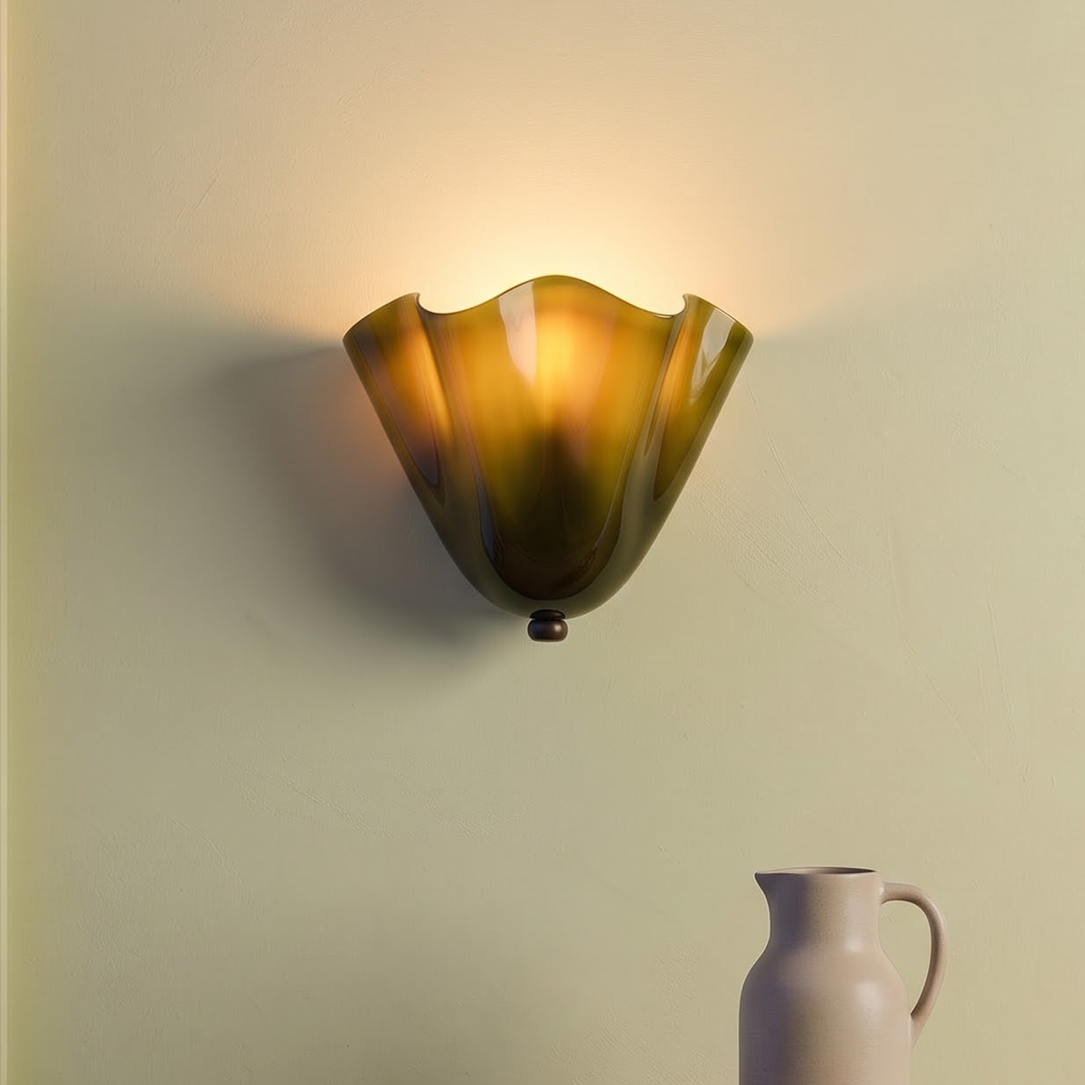 Olive green rippled glass wall sconce above an oak sideboard