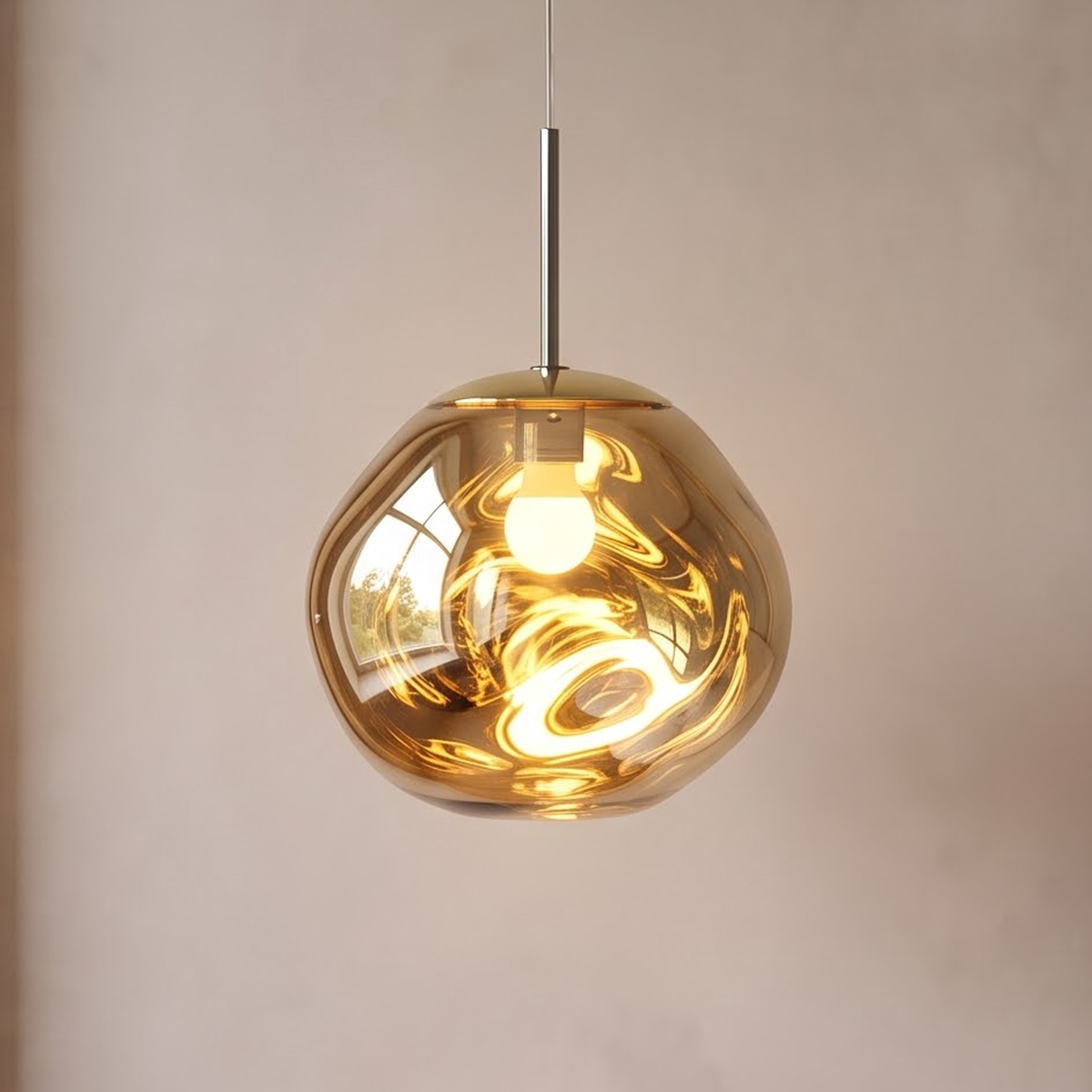 Gold molten glass pendant light glowing above an oak side table