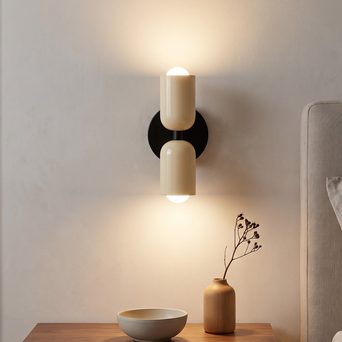 Cream lacquered up and down wall sconce beside an oak door