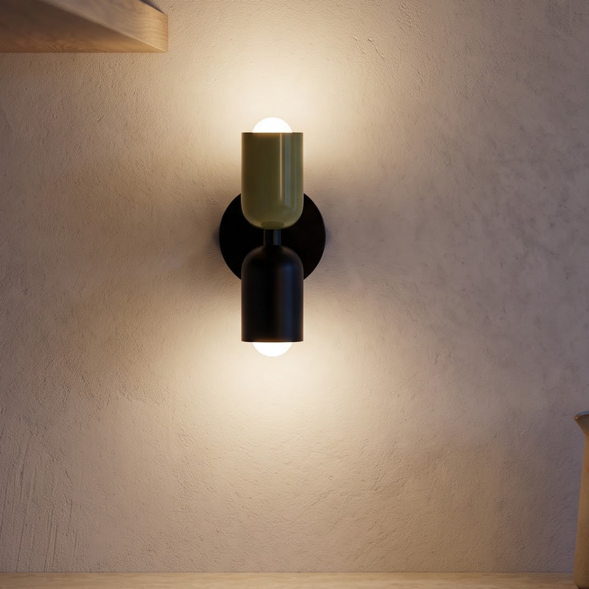 Olive and black up and down wall sconce above a stone counter