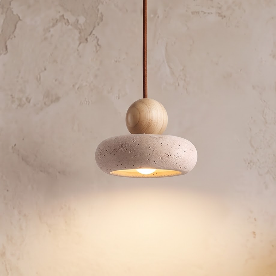 Small stone pendant light with natural wood ball over a side table