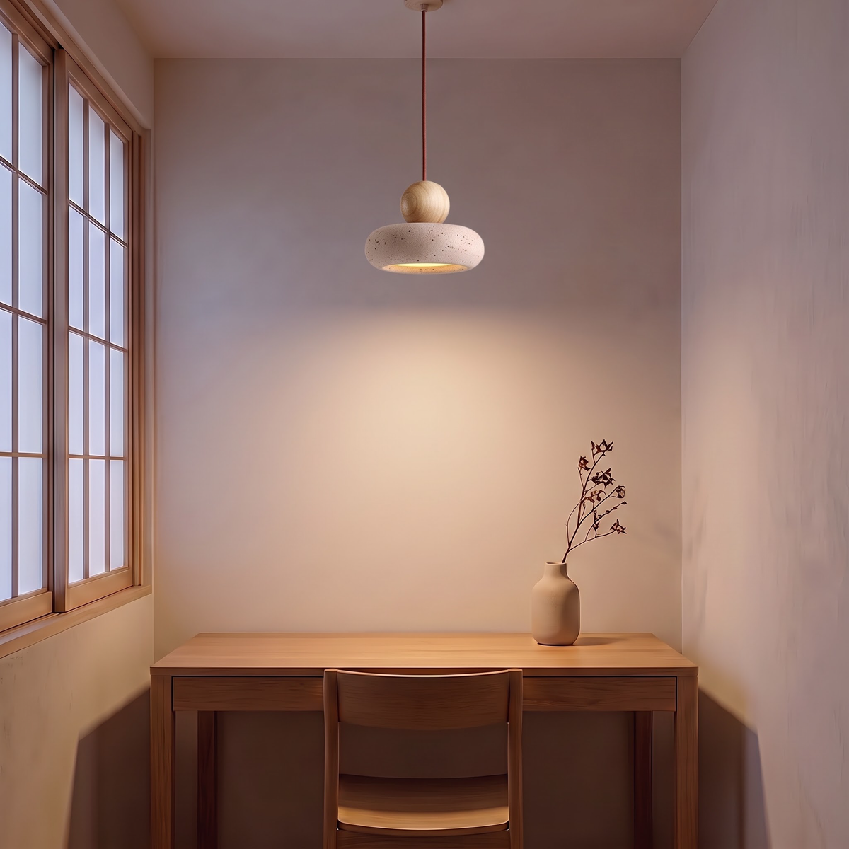 Small stone pendant light with wood ball above an oak desk