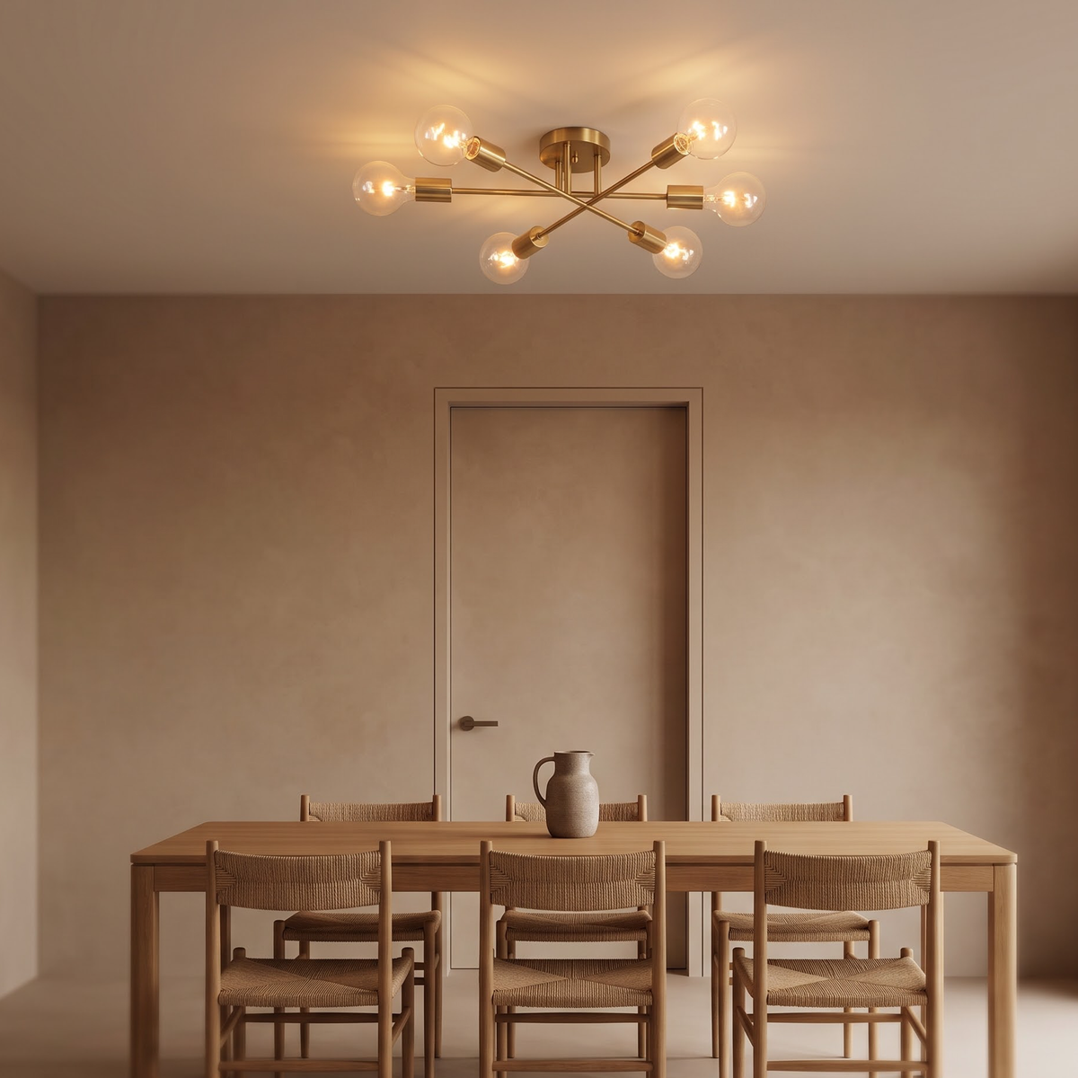 Brushed gold sputnik chandelier over an oak dining table at night