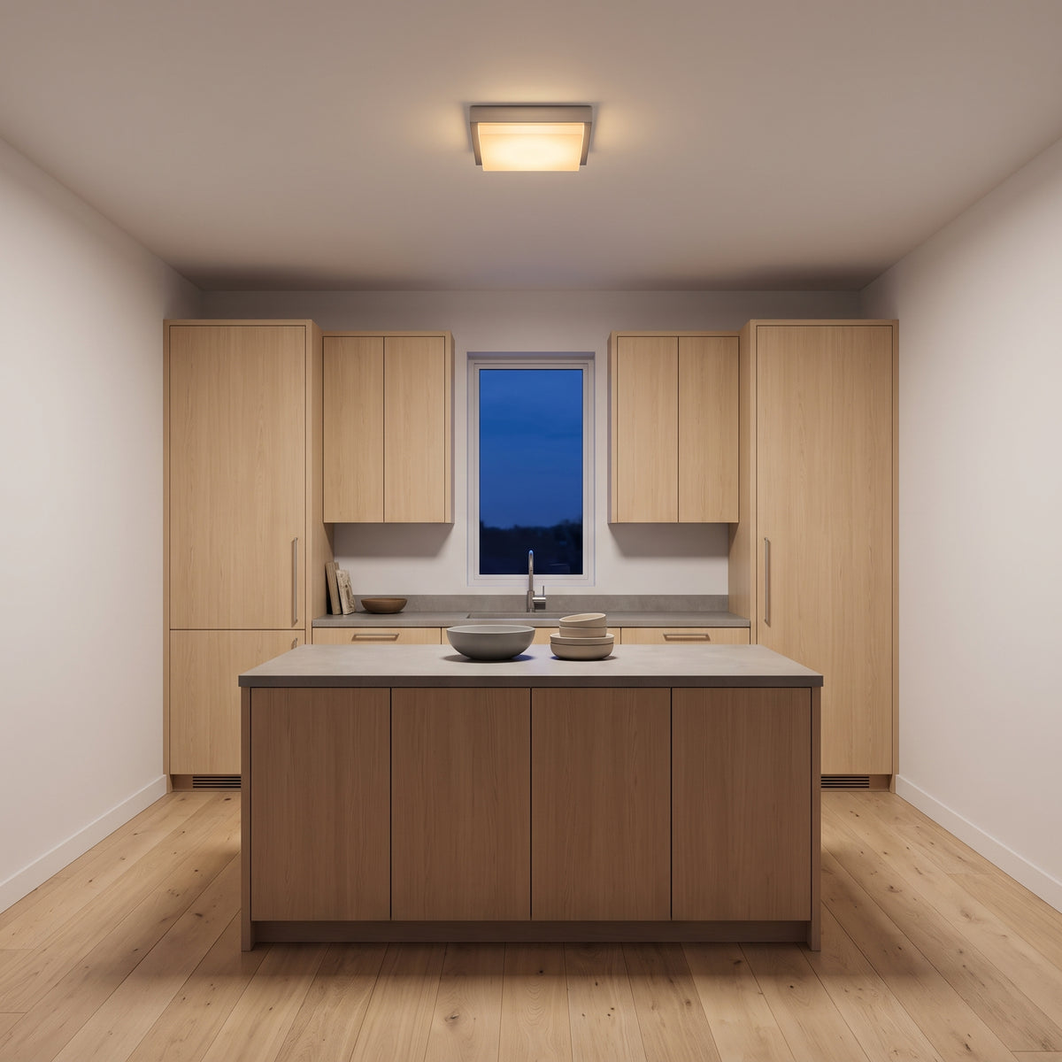 Stainless steel square flush-mount ceiling light above a stone kitchen island