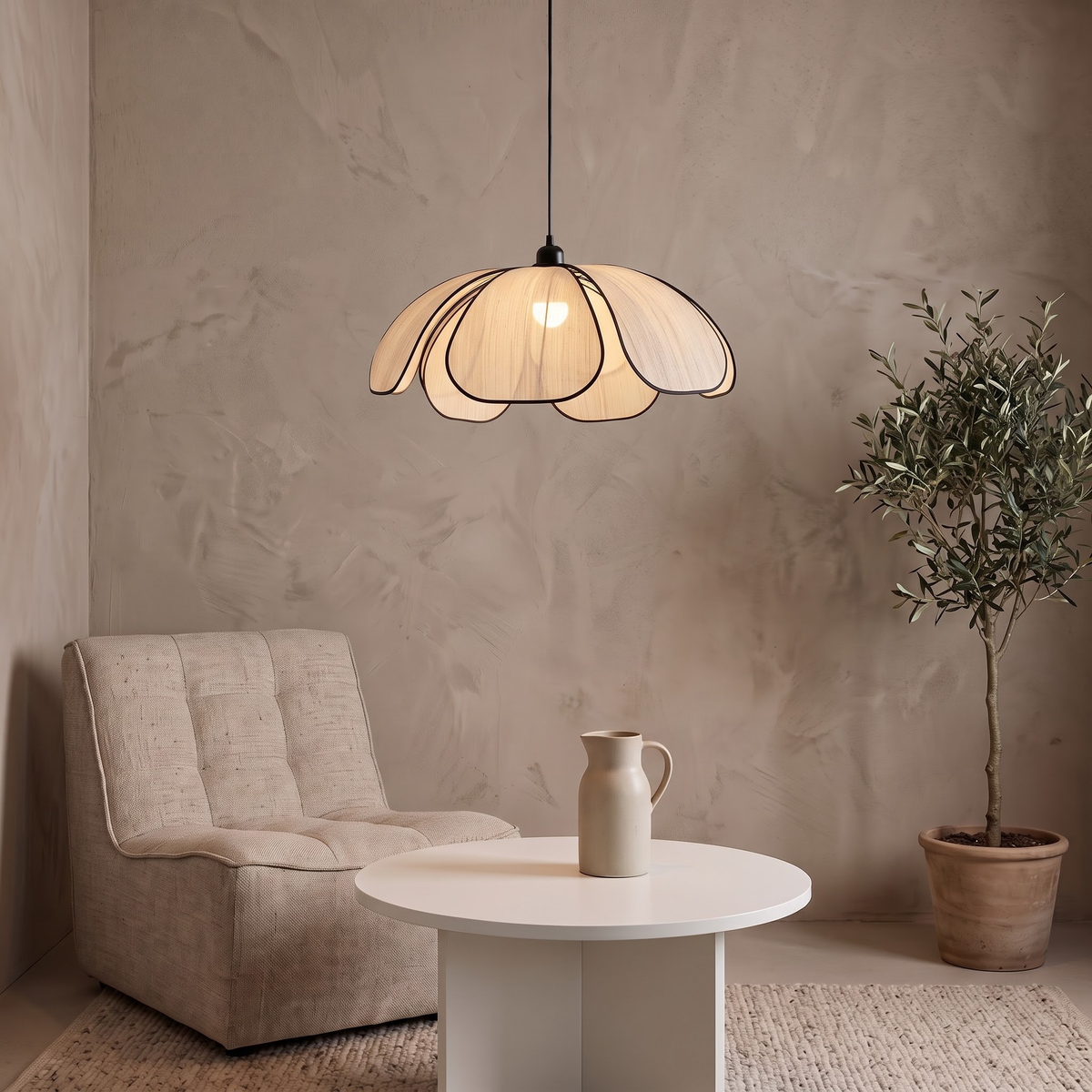 Cream fabric lotus pendant over a round side table in a living corner