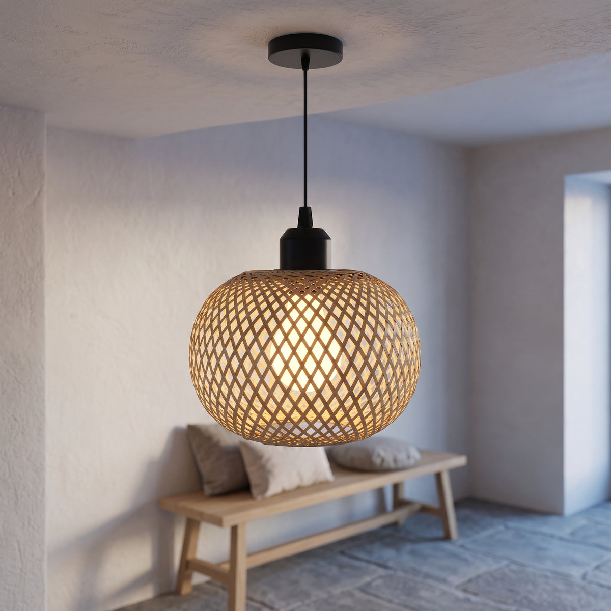 Bamboo globe pendant with black cord lighting a plaster entry hallway