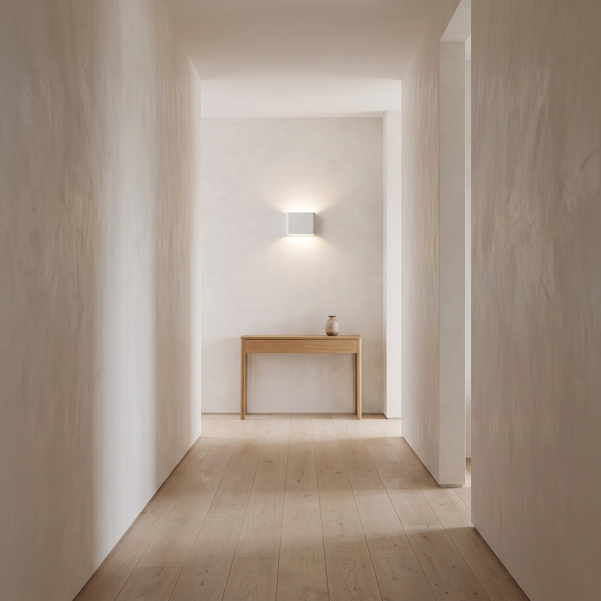 White up/down block wall light washing a limewashed hallway wall