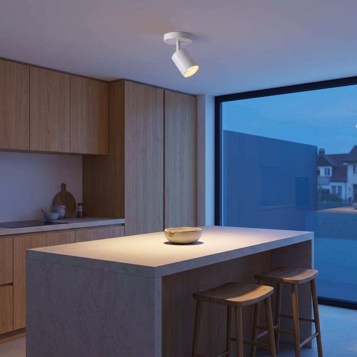 White Ten mini ceiling spotlight above an oak kitchen island at dusk