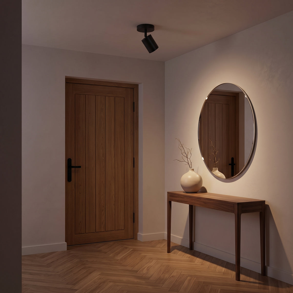 Black Ten semi-flush spot on the ceiling of an entrance hall with oak door