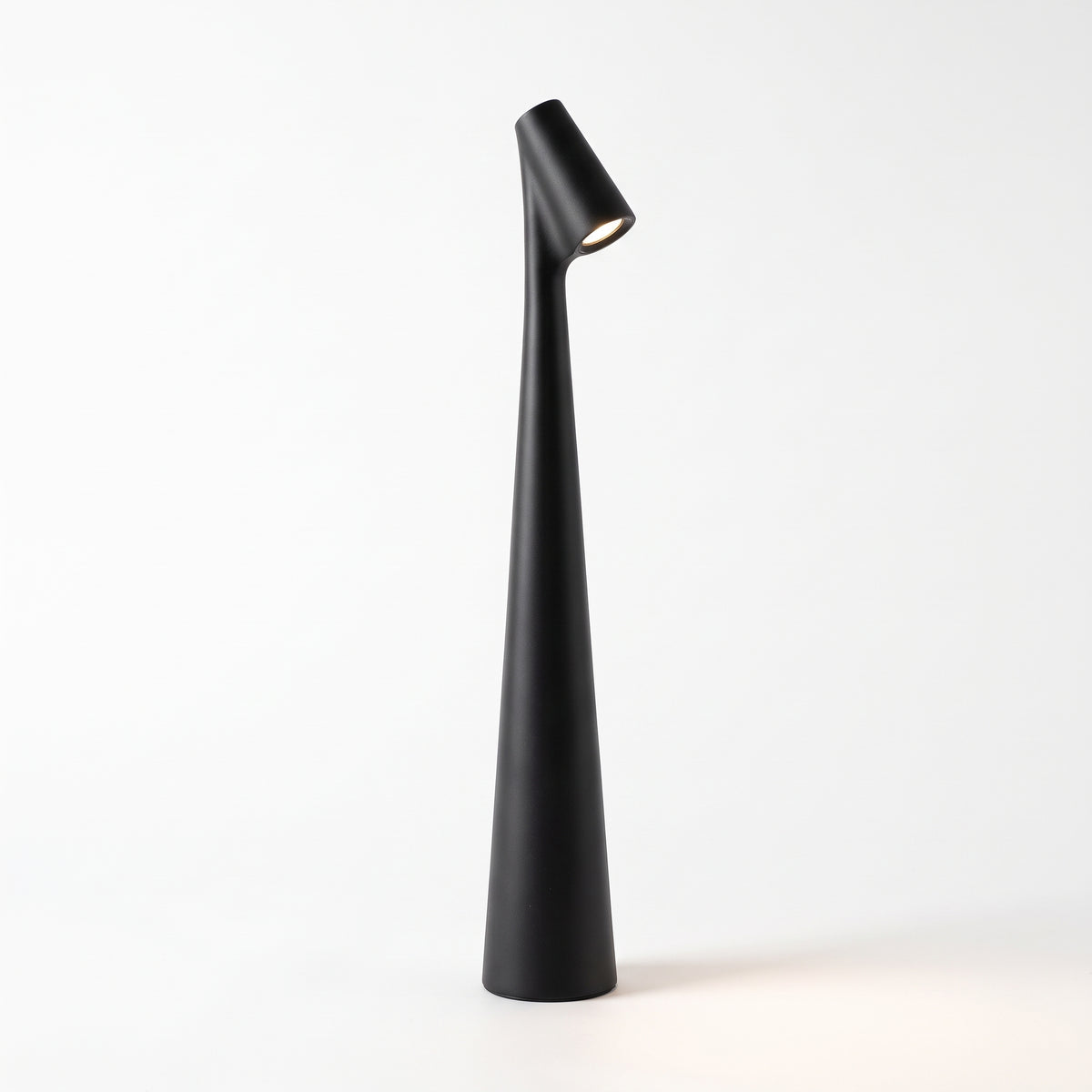 Slim matte black cordless table lamp with angled LED head