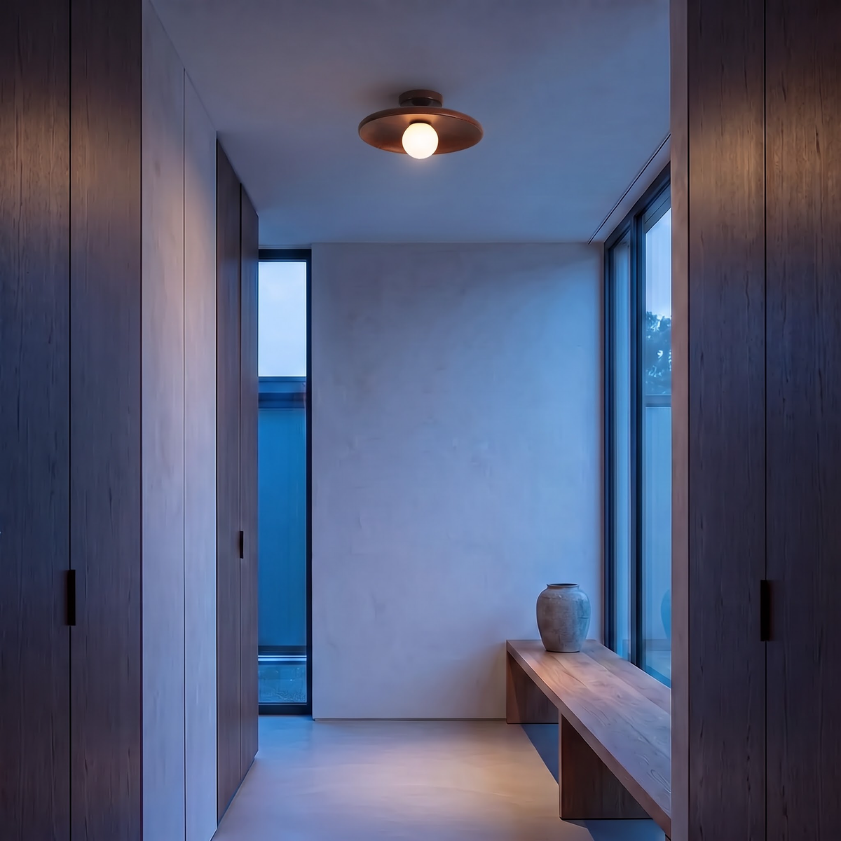 Walnut wood flush ceiling light with glass globe in a corridor