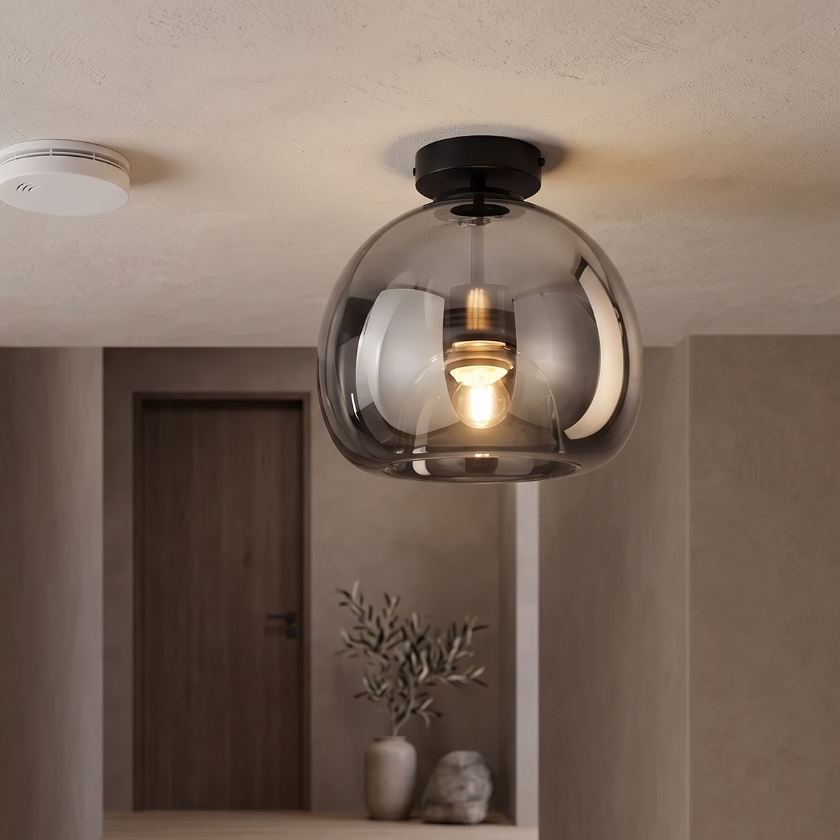 Smoke grey bubble glass flush ceiling light on a stair landing