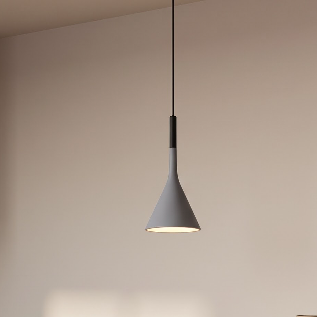 Blue-grey cone pendant hanging low over a stone kitchen counter