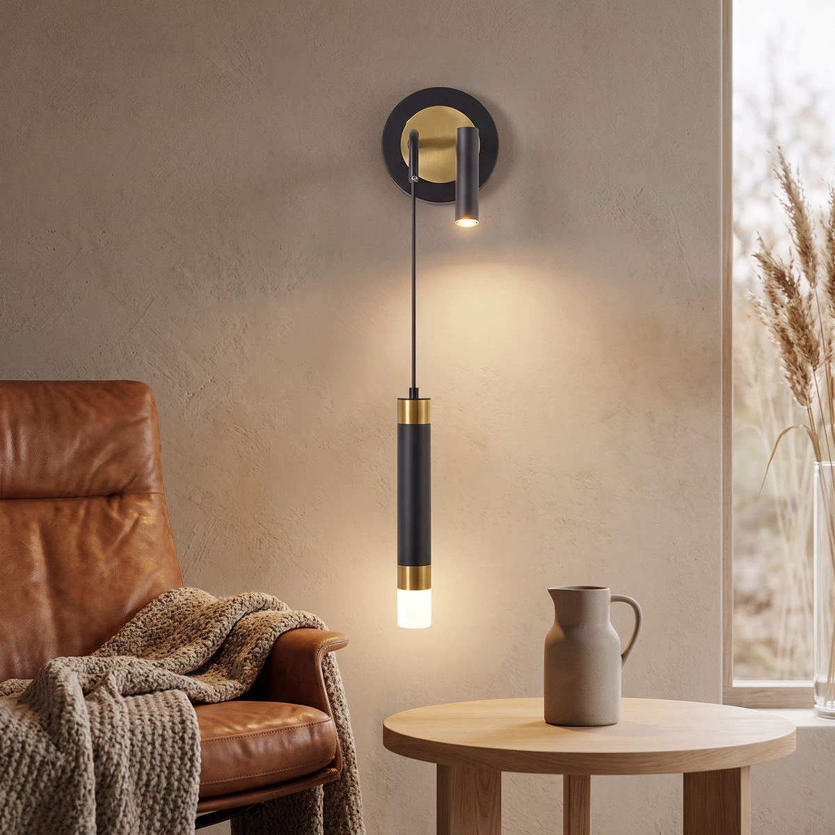 Black and gold wall light with reading spot beside a leather lounge chair