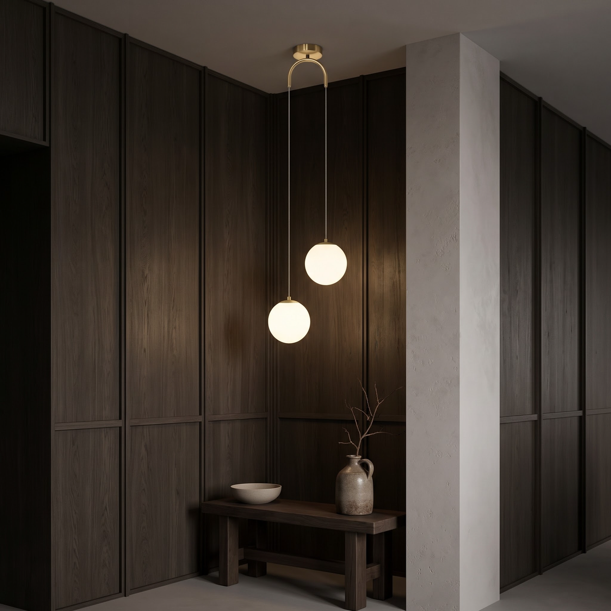 Brass two-globe pendant light in a dark oak-panelled entry