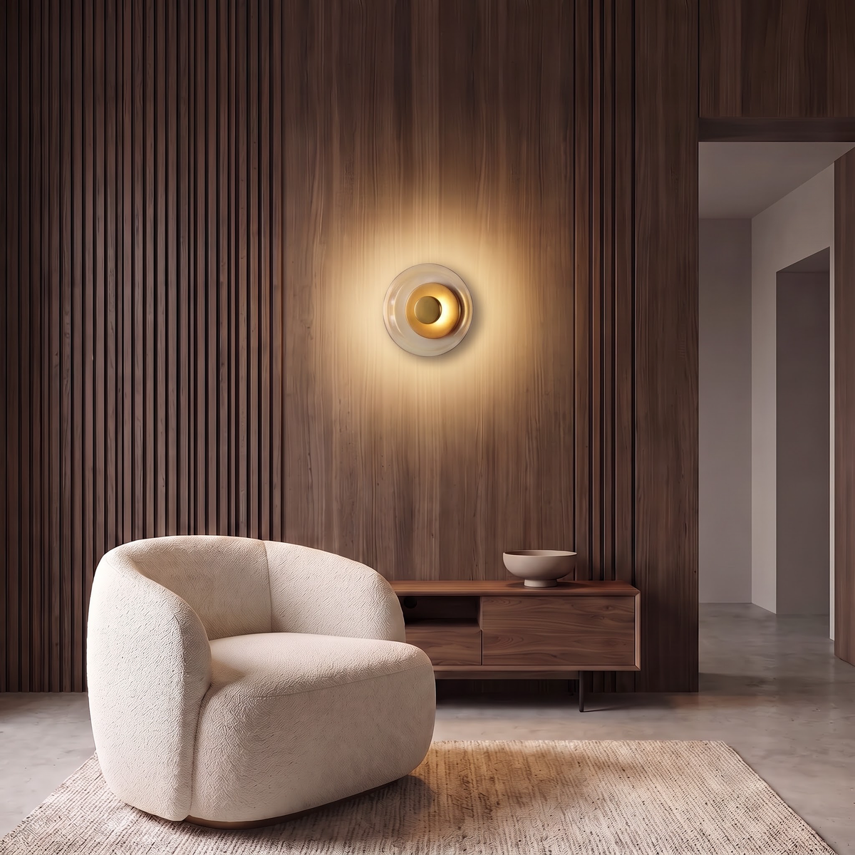 Round amber glass wall light on an oak slatted wall above an armchair